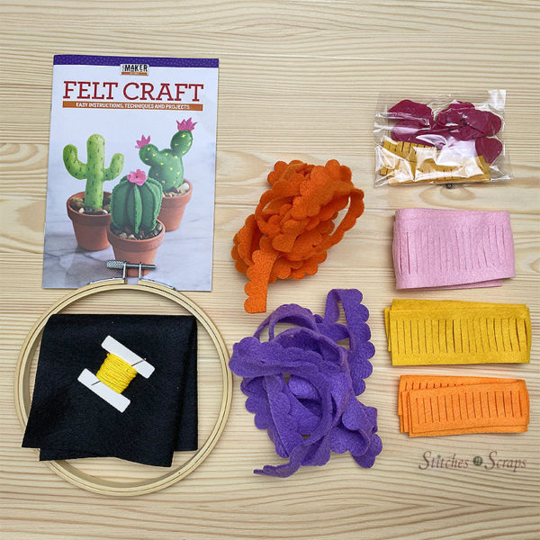 Contents of the Felt Flowers Mini Makers Kit - Felt pieces, embroidery hoop, embroidery floss, and instruction booklet