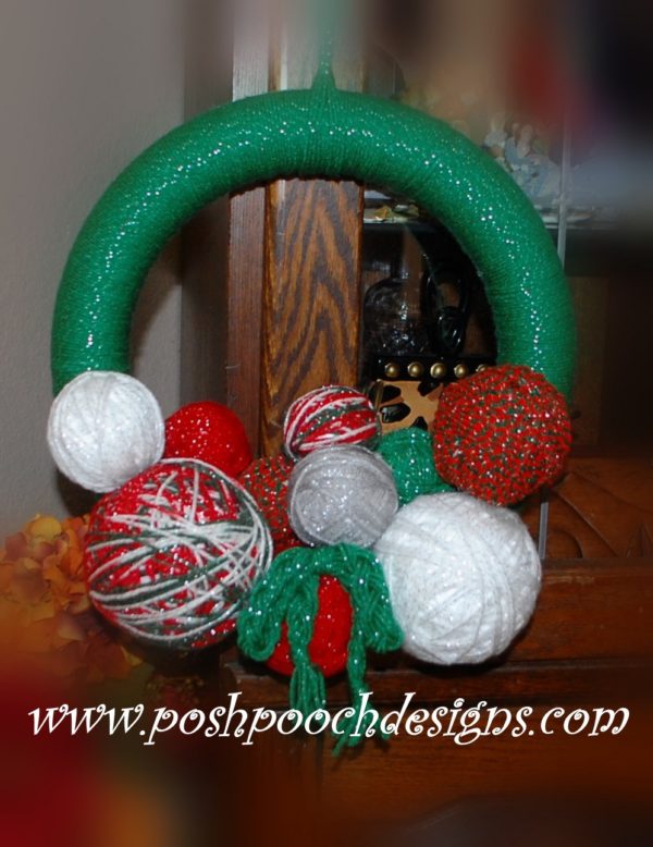 A wreath decorated with balls of yarn - Yarn Ball Wreath from Posh Pooch Designs