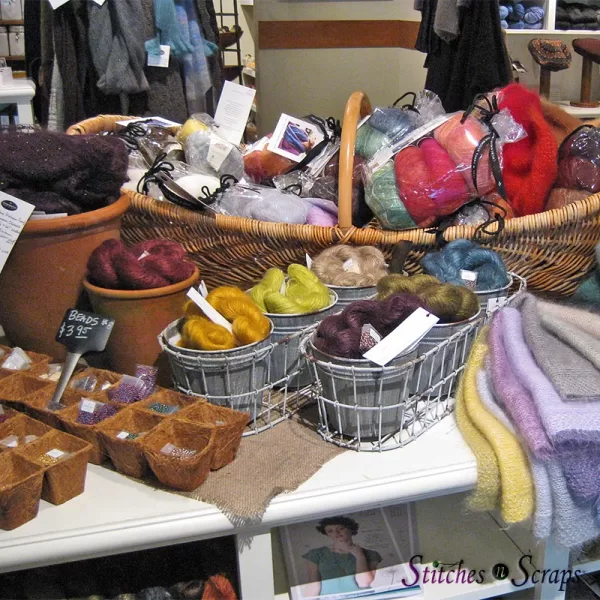 Beads and yarn displayed in planter pots