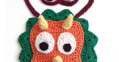 Cera the Triceratops Bib - a free crochet pattern on StitchesNScraps.com