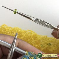 Place bead on hook - Knitting with Beads Tutorial on Stitches 'N' Scraps