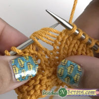 put loops on left needle - Bubble Stitch washcloth on StitchesNScraps.com