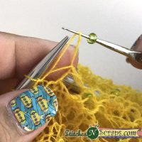 take stitch off left needle - Knitting with Beads Tutorial on Stitches 'N' Scraps