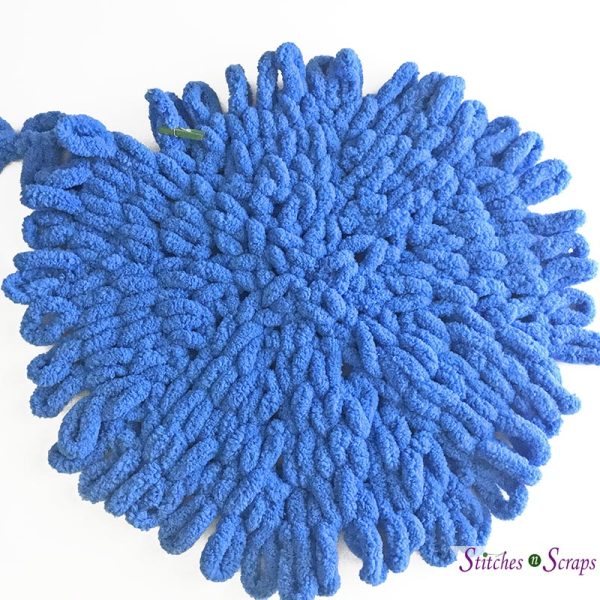 A blue, finger knit circle on a white background - Bottom circle - Finger Knit Basket - Pattern on Stitches n Scraps