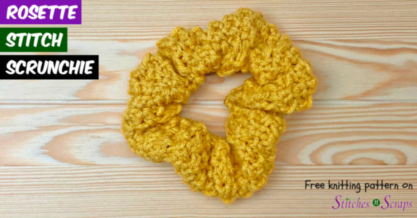 A yellow, textured scrunchie on a wood table. Text: Rosette Stitch Scrunchie - Free Knitting Pattern on StitchesnScraps.com