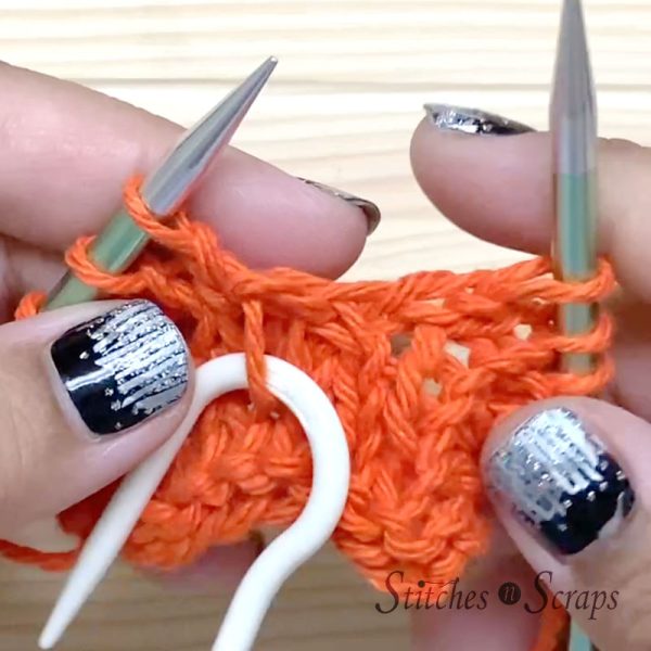 Place stitch on cable needle
