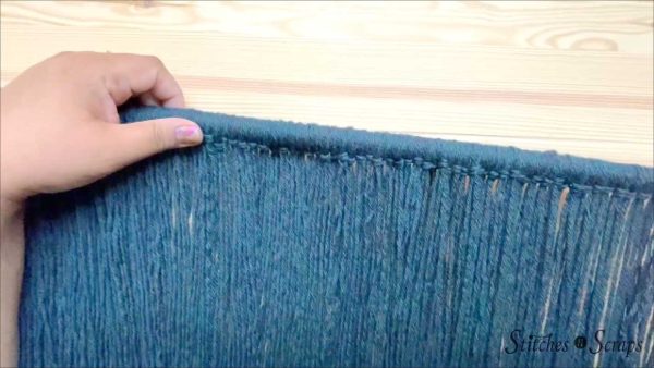Attach blue yarn to dowel