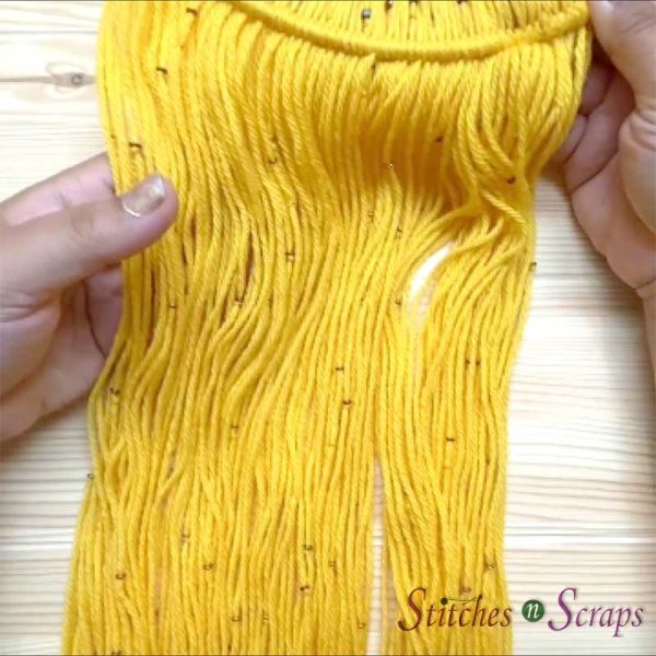 O-Beads on yellow yarn