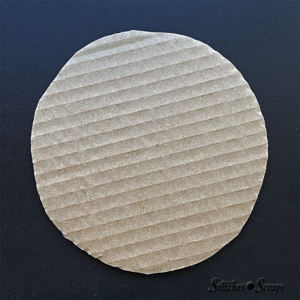 A 6 inch circle cut out of cardboard