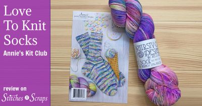 Annie's Love to Knit Socks Kit Club review on Stitches n Scraps. Image shows sock pattern and skein of yarn on a table.