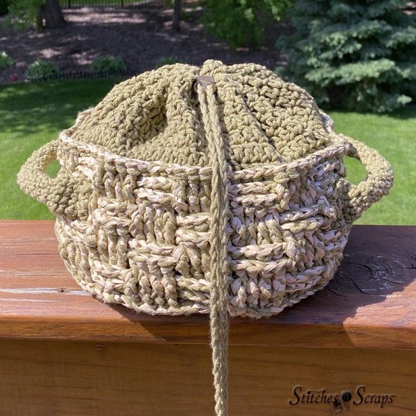 Drawstring soft top basket with cover closed. 