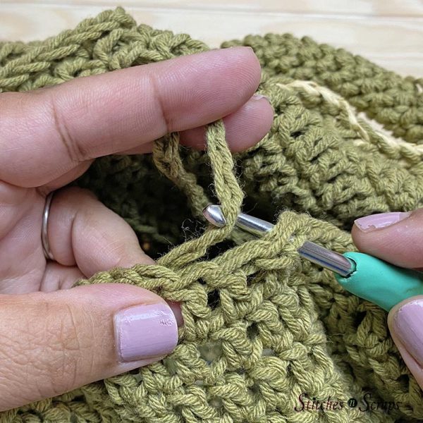 Weave drawstring into top