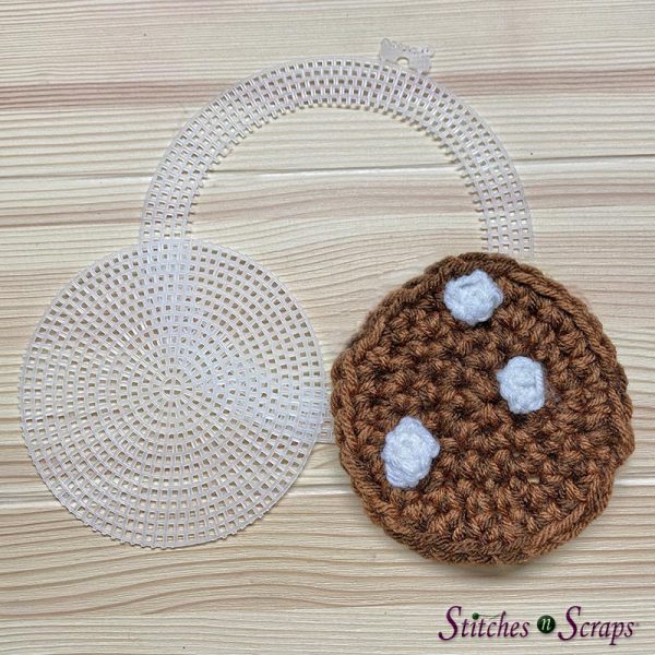 Trimmed plastic mesh circle matching size of coaster