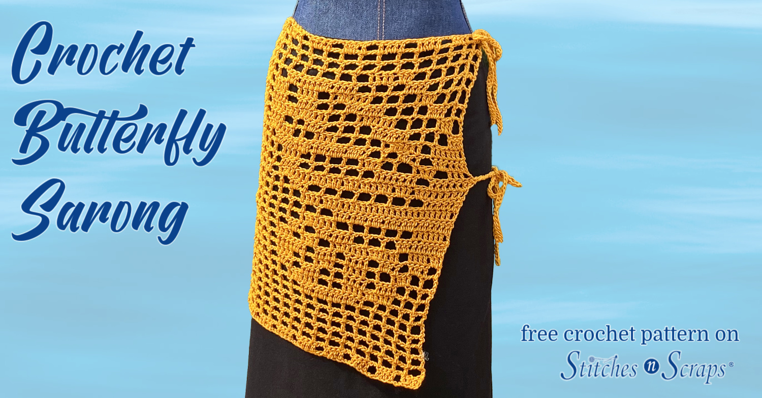 Crochet butterfly sarong, shown on a dress form against a watery background