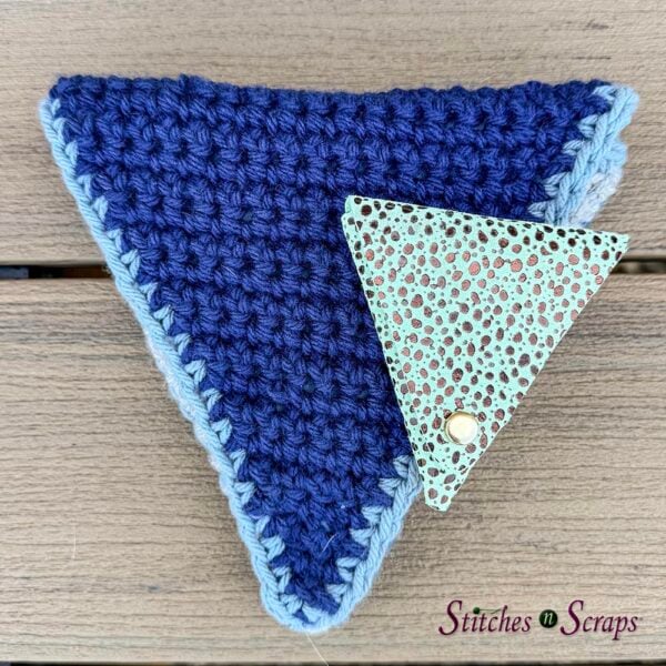 Mini leather pouch from Stacy on top of larger crochet pouch