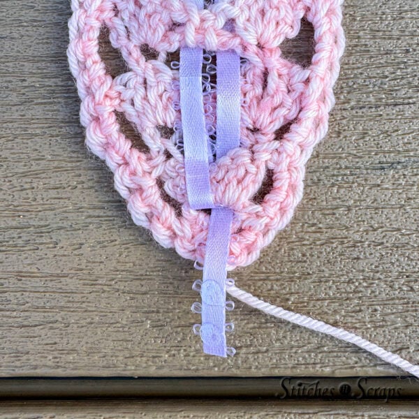 Trim and glue ribbon tails in place